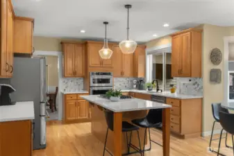 Experience the epitome of entertainment with the expansive kitchen island, a focal point for culinary creativity and social gatherings, offering ample space for food preparation, casual dining and lively conversations.