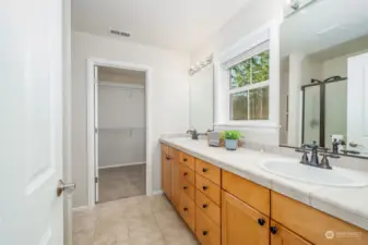 Primary bathroom with double sinks and lots of storage will make it easy to pamper yourself.