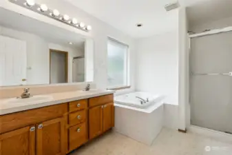 The extra long two-sink vanity has room for both of you to spread out, and great lighting above plus handy storage drawers.