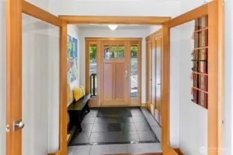 Douglas fir trim, solid doors and custom tilework in the mudroom entryway.