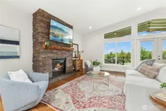 Propane fireplace and wall of windows facing NW