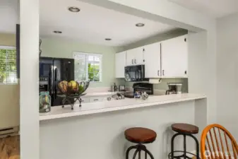 Brightly lit by a nearby window or sliding door, the area enjoys natural light throughout the day, enhancing mealtime ambiance.