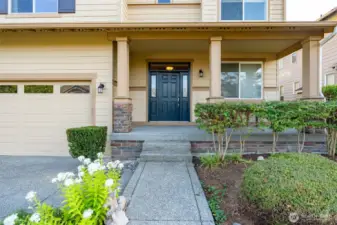 Large covered front porch invites your visitors up to the entryway.