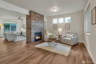 This dual sided fireplace serves this darling living room as well as the family room.