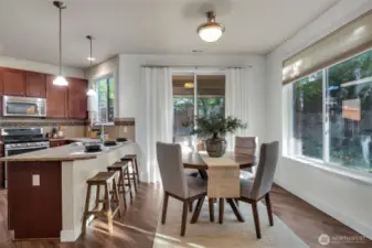 The dining area sits off the kitchen overlooking the backyard.