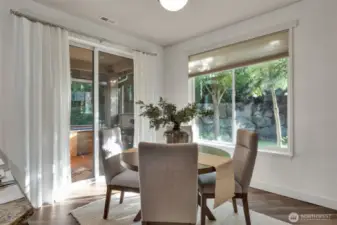Slider door steps out to a sunroom maximizing your entertainment space.