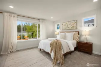 The primary suite is the perfect size and has beautiful windows. Top down bottom up shades in all bedrooms!