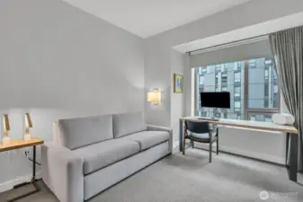 looking into the second bedroom currently set up as an office with pull out.