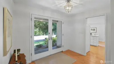 This bright entryway offers a seamless flow into both the kitchen and main living spaces.