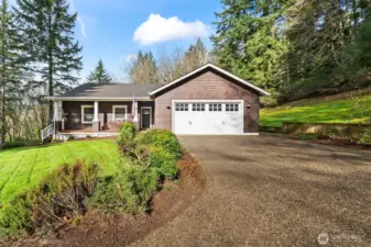 Welcome to your new home, nestled at the end of a private drive in a clearing surrounded by towering firs.