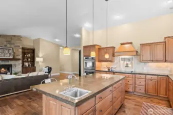 The large island flowing into the living room is the perfect spot for casual meals or gathering with friends.