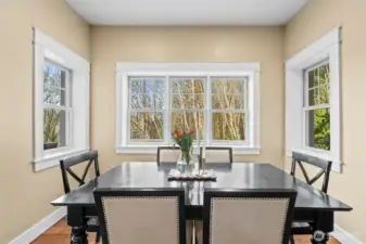 Formal dining nook allows nature's beauty and natural light to flow in and illuminate your dining experience.