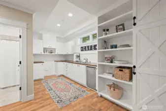 Partial kitchen in the basement is pre-wired for a full-size range, making the basement suitable as a complete separate suite thanks to it's separate entrance and parking, or a great spot to park the  snacks and refreshments while watching the game or movie night.