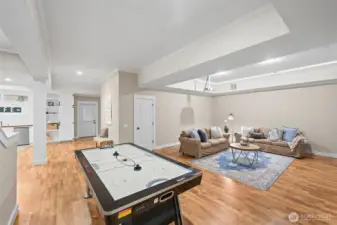 A full-footprint, fully-finished basement with separate entrance maximizes livability and function.  Air hockey table conveys with the home unless otherwise requested.