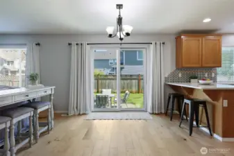 Nook for optional eating space here, with slider to back patio and yard.