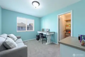 Currently used as a home office, this room boasts a walk-in closet!