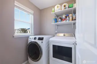 Dedicated laundry room upstairs for ease and convenience!  Window provides natural light, and you can simply tuck it all behind a closed door if desired.