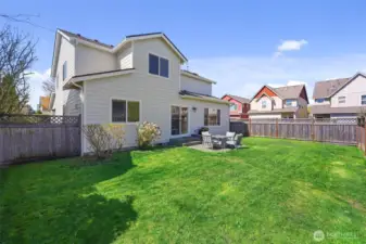 Roomy and simple backyard are ideal for littles, pets, or relaxation without high maintenance!