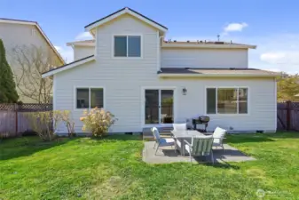 Patio off slider provides space for dining, BBQ, firepit.