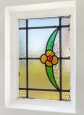 1 of 2 stained glass windows flanking the entry