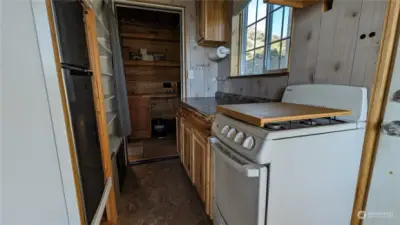 Kitchen with stove and refrigerator.