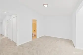 Primary bedroom looking down the hallway towards the other 2 bedrooms.