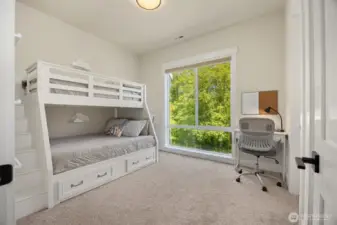 The second bedroom on the main level connects to a Jack & Jill Bathroom and has its own walk-in closet.
