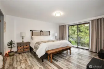 primary bedroom with slider to deck area