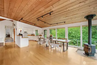 Looking from where the couch is all the windows look out to the beautiful trees and lets in so much natural light.