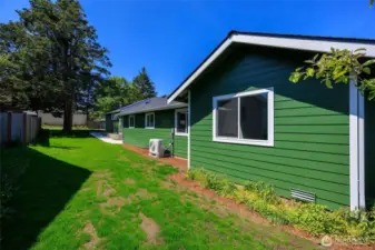Expansive partially fenced yard.