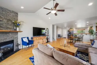 Floor-to-ceiling fireplace and vaulted ceilings in the living area