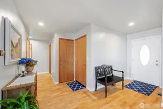 Hall to garage, utility room, and primary suite
