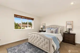 Primary suite sits at back of house, overlooking amazing backyard.