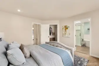 Another view of primary, looking to ensuite and walk in closet.