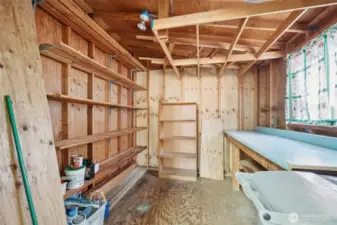 Large storage shed located at the end of the carport