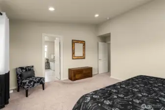 Primary suite features a large bath and walk in closet