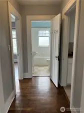 Hallway separating social and bedroom areas.