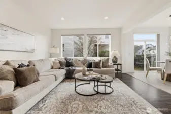 Spacious living room that offers an open concept to the kitchen and breakfast nook.