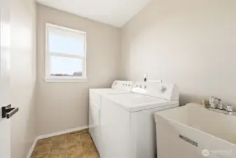 Laundry room just off the primary