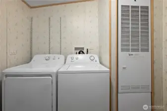 Laundry room with cabinets & shelving