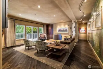 Warm, inviting, and thoughtfully designed, the living space blends custom finishes with everyday comfort, highlighted by rich engineered hardwood flooring, tailored linen drapery, and seamless access to the back deck.