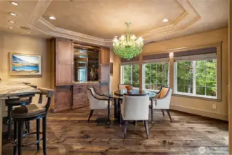 Custom built-in cabinetry with granite countertop offers both display and storage, ideal for glassware, serving pieces, or a curated bar setup.