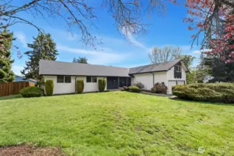 This beautiful sprawling rambler boasts flexible spaces and large yard