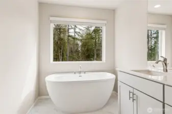 Spa-inspired primary bathroom showcasing a freestanding soaking tub. Photos are representative only and may display different color package and/or upgrades.