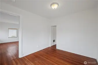 Bedroom 2 with wooden flooring.