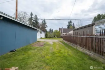 Side of garage to rear lane, extra parking.