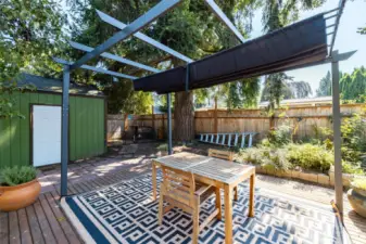 Backyard is simply the perfect oasis to relax or entertain.  Large deck has a sunshade.