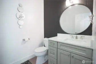 Powder room/half bathroom off entry