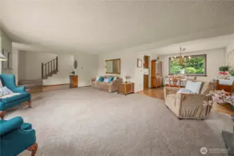 View of dining room, kitchen, entry and stairway from living room. Can you see the potential for entertaining here? And it just keeps going.