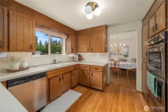 Kitchen with dining room beyond. Imagine spreading out on these expansive counters!
